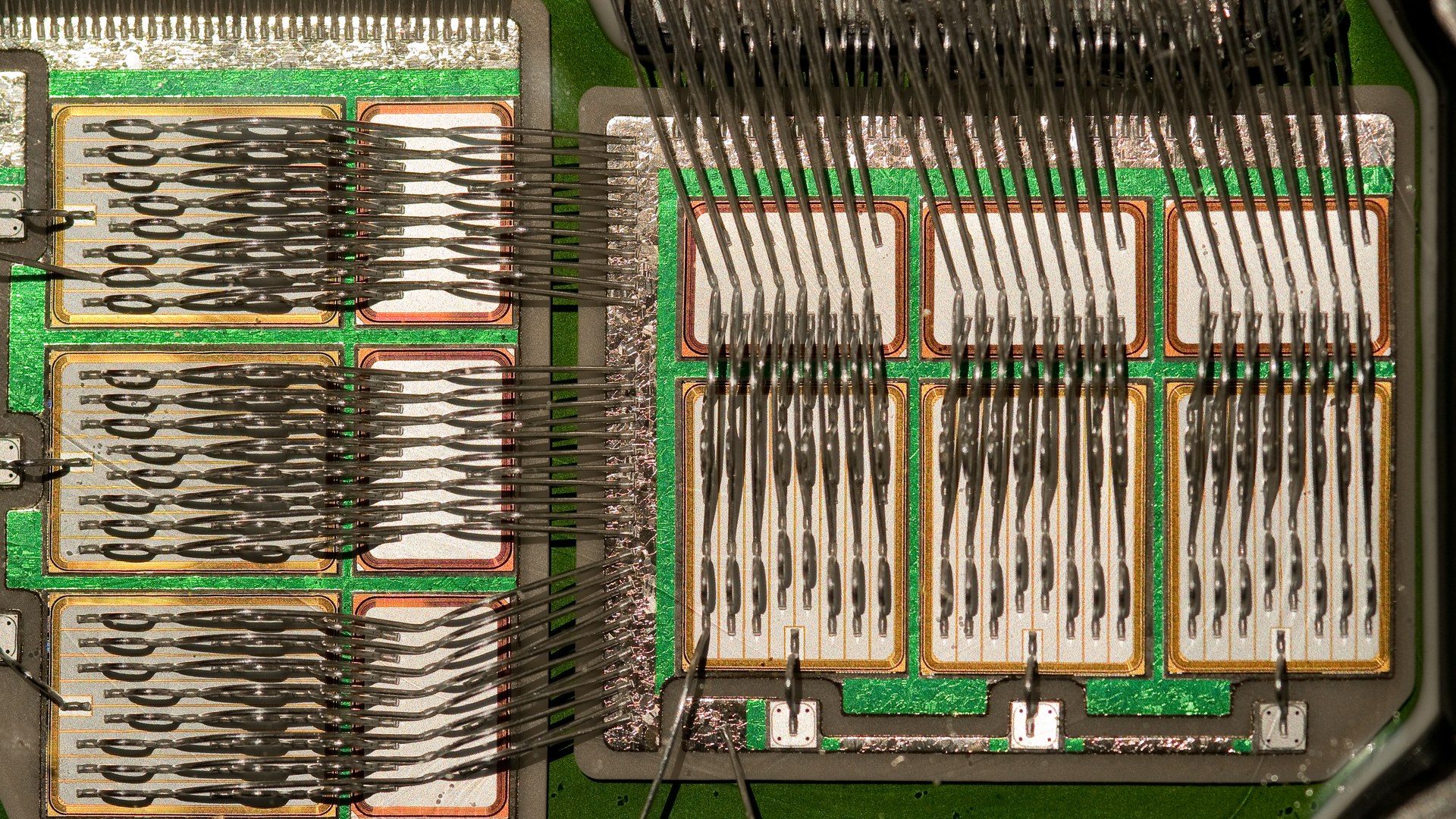 An IGBT power module with its cover removed, exposing the silicon dies and bond wires that switch high current inside an electric vehicle or an industrial drive. Photo: Pslawinski, CC BY-SA 3.0, via Wikimedia Commons.